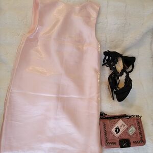 Chic Pink Satin Dress with Black Heels and Handbag